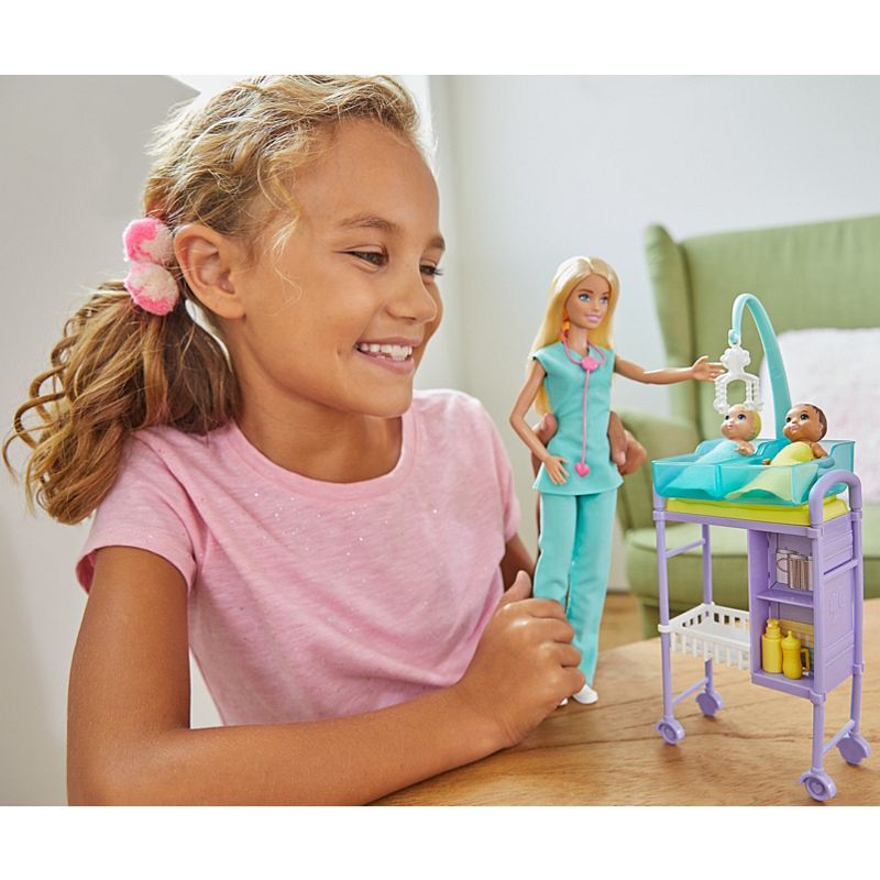 Mattel Barbie Baby Doctor Playset with Blonde Doll, 2 Infant Dolls, Exam Table and Accessories